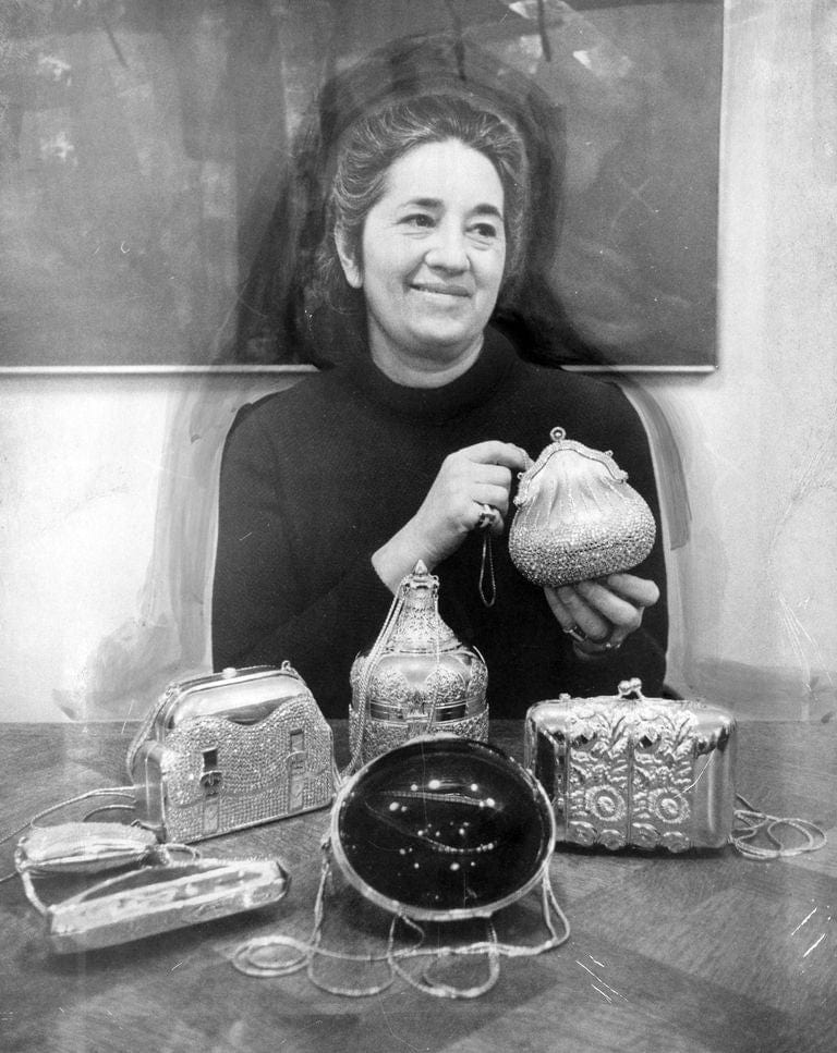 Judith Leiber with an early collection of her handbags